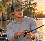 Male fishing model wearing Loden and black bass patch hat; digital mockup