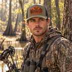 Male bowhunter wearing a Buckeye Hunting Club hat with a smooth unstitched leatherette patch