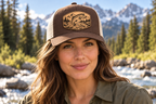 Trout — female close-up wearing Chocolate Chip/Birch hat with Buckskin patch; mockup